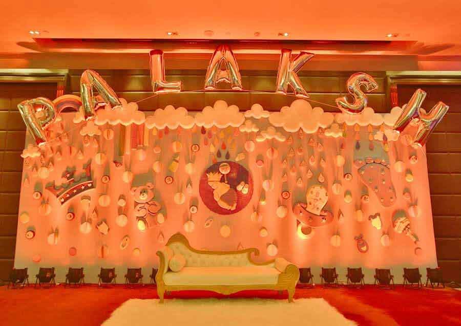 This baby-theme stage with your child’s name on it will add the spark to the occasion